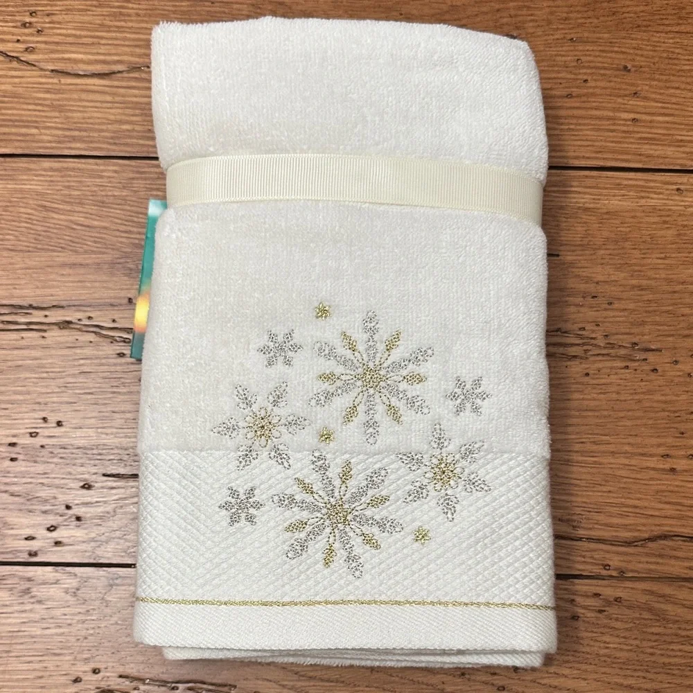 St. Nicholas Square Cream Towels with Silver and Gold Snowflakes